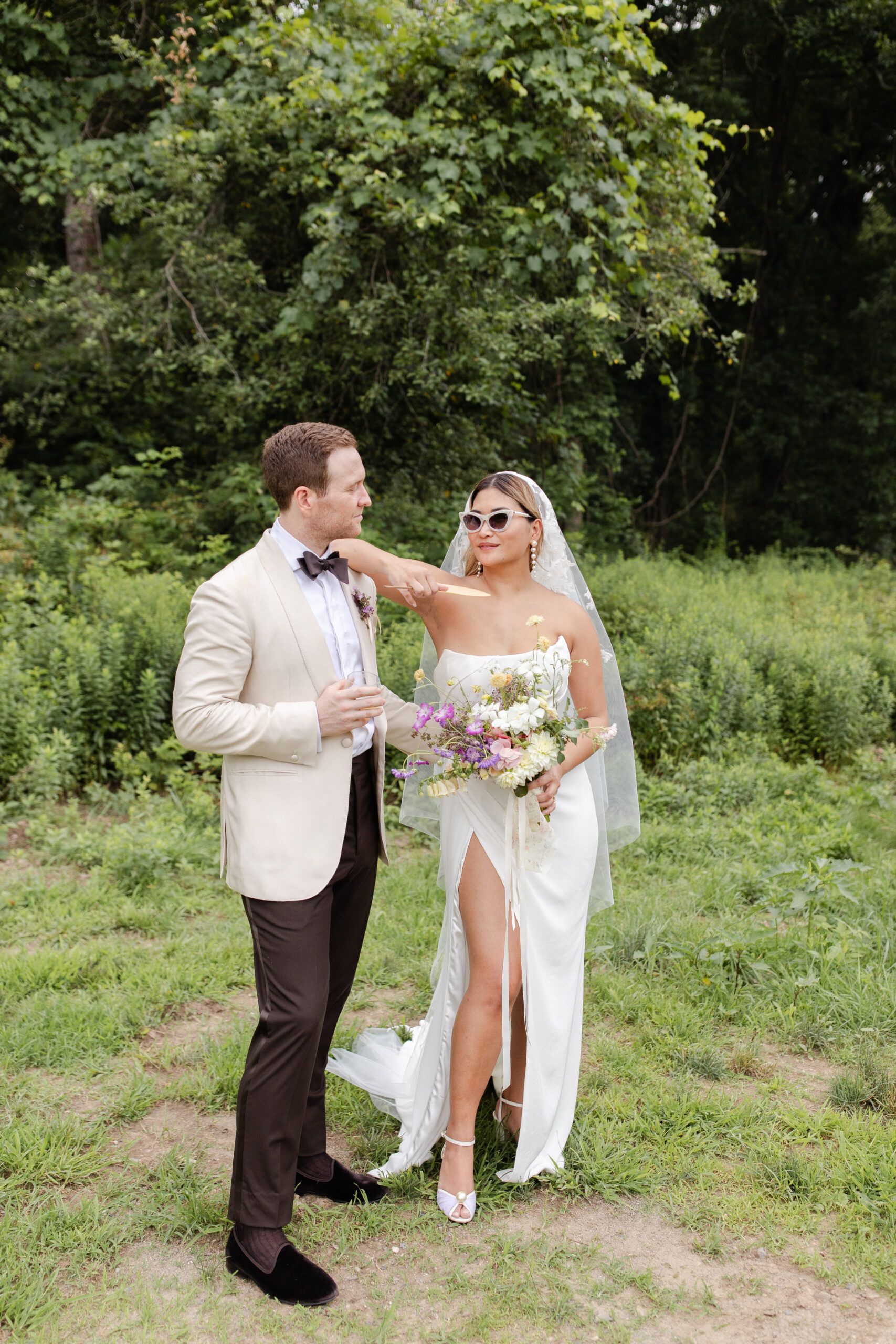 Newlyweds in the meadow at an Old Mill wedding